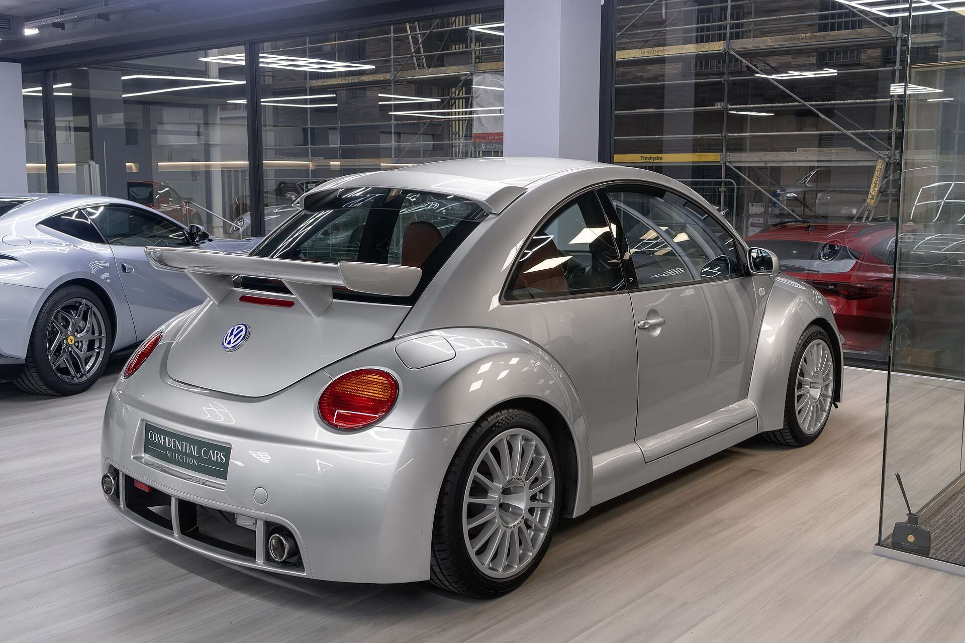 Silver Volkswagen New Beetle RSi from the rear three-quarter, showing the twin spoilers, rear diffuser and twin exhaust outlets